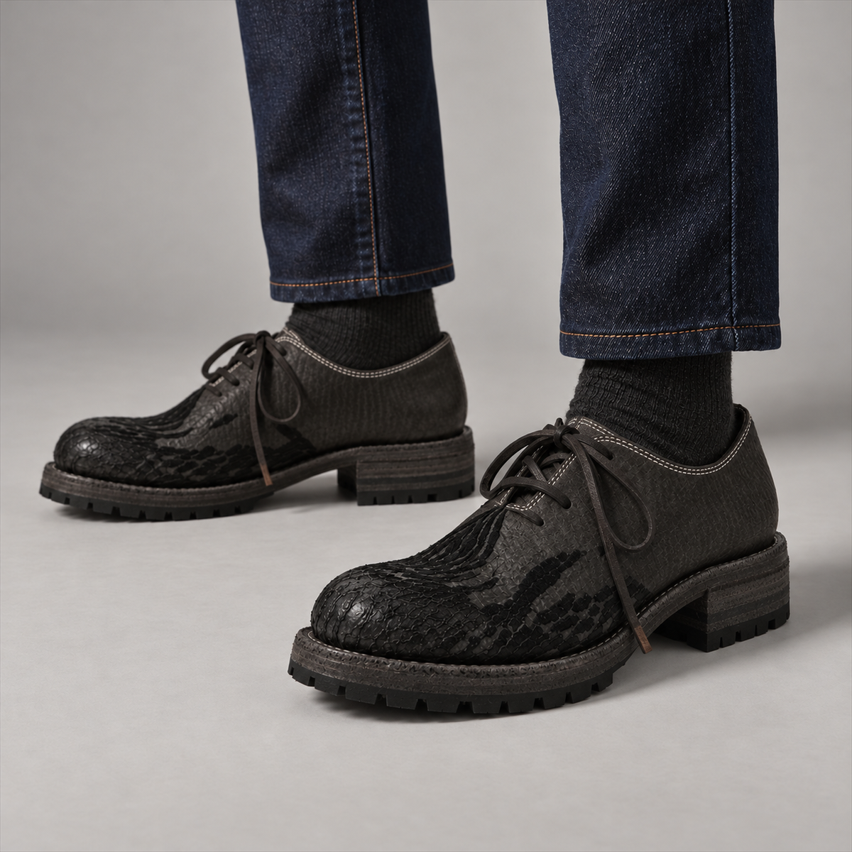 Sawyer Dark Slate Derby shoes worn with dark denim, with plain leather lace holes
