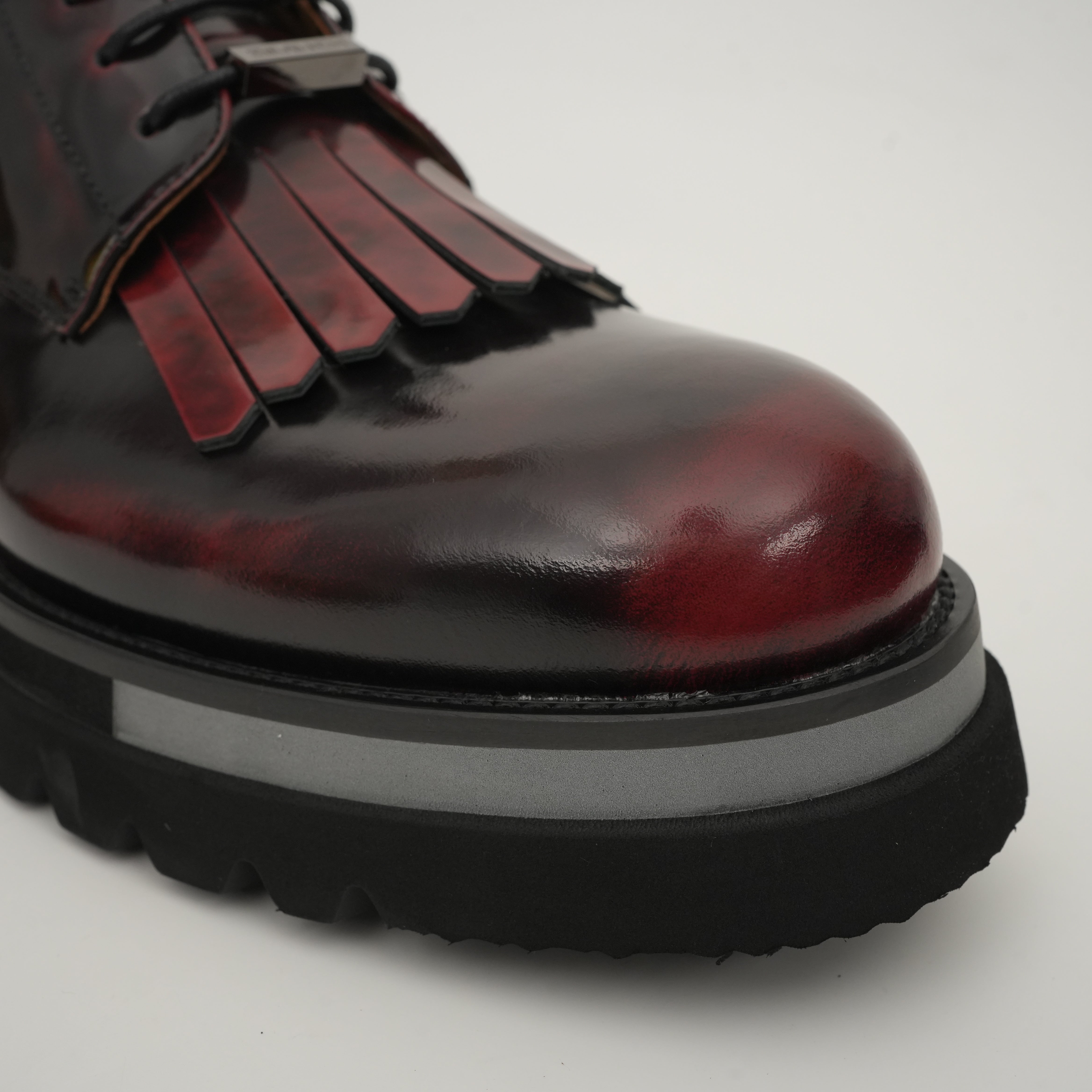 Black Patent Fringe Lug Sole Boots