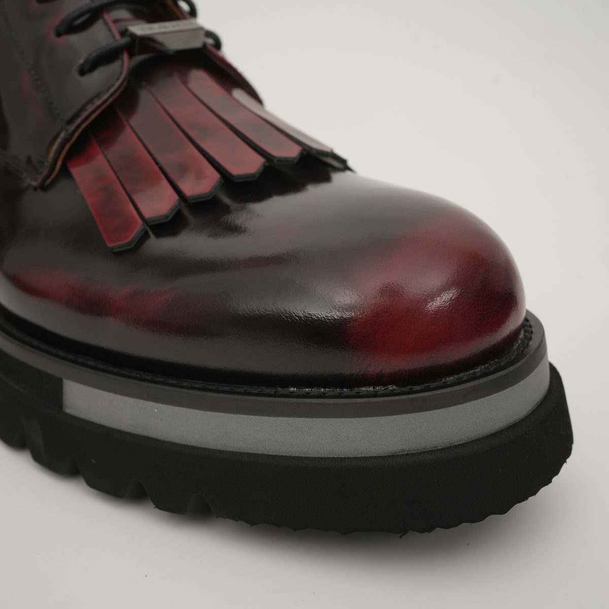 Black Patent Fringe Lug Sole Boots